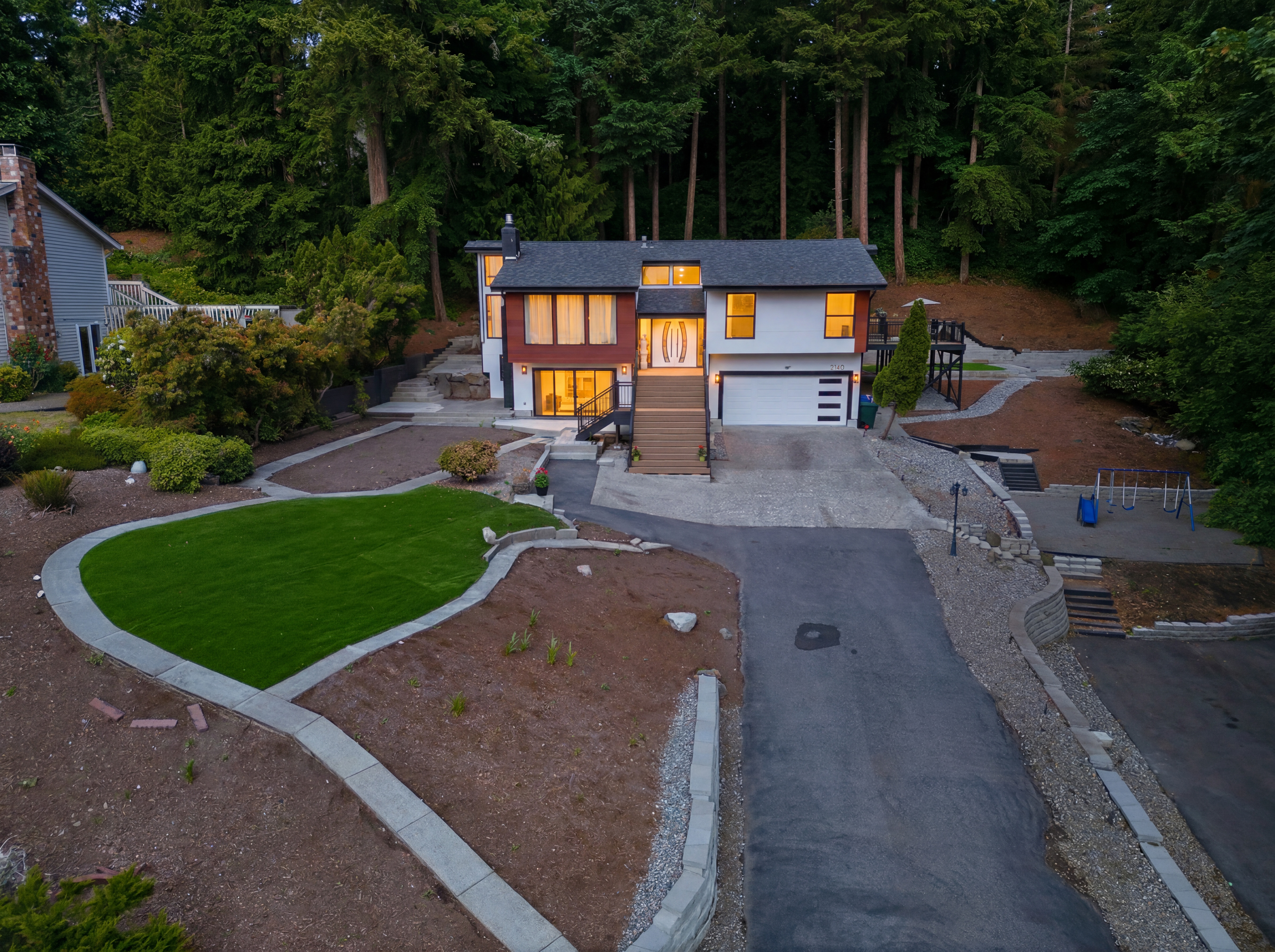 Modern front exterior of 2140 192nd Ave SE at dusk