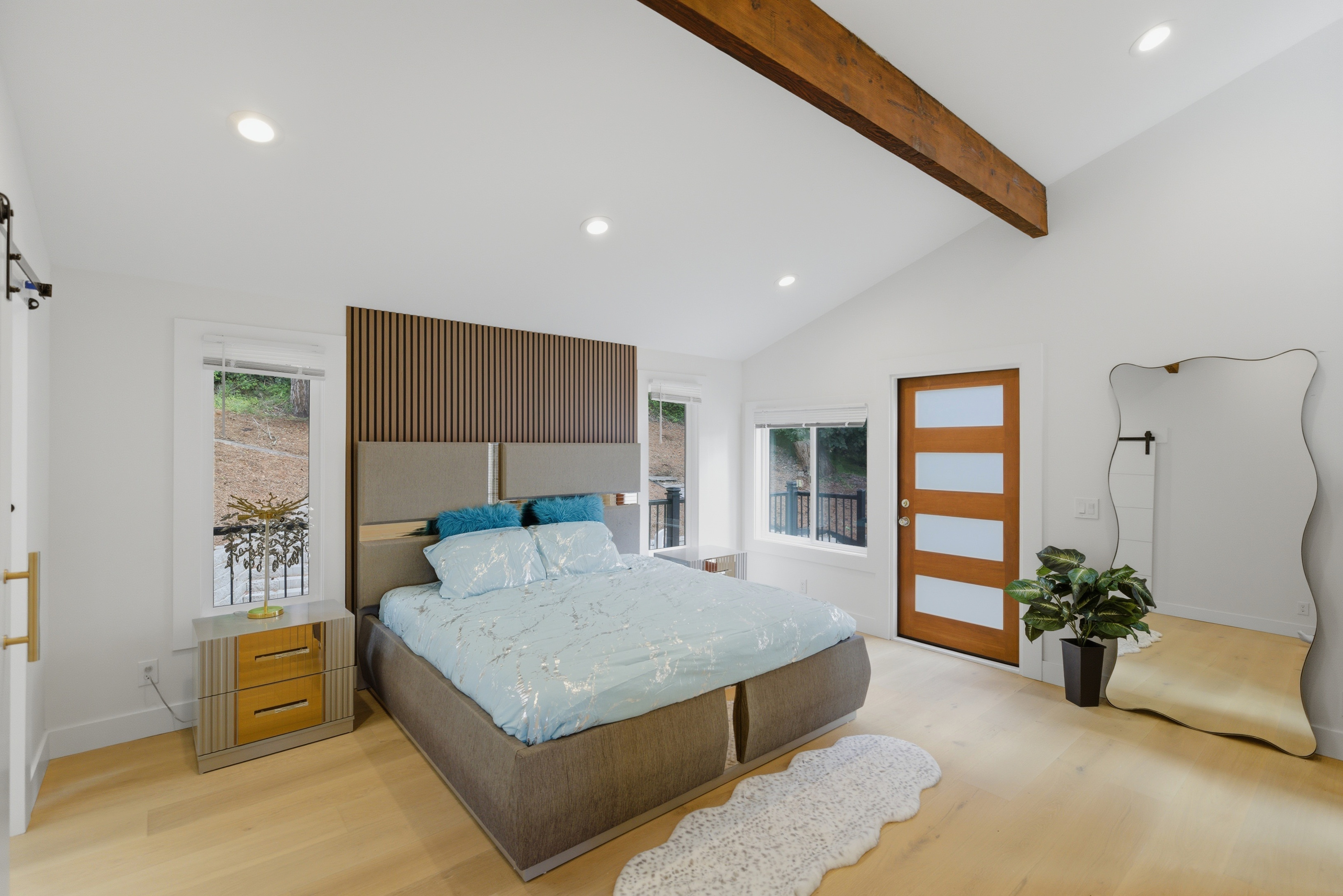 Primary suite with natural light and lake-side outlook